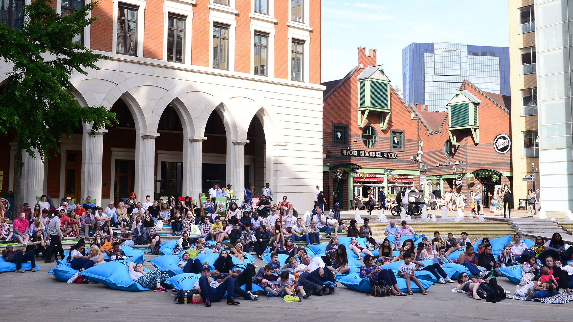 Large crowd outside in Brindleyplace, Birmingham.