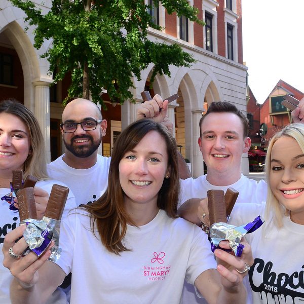 Group of people holding chocolate bars at Brindleyplace in Birmingham.