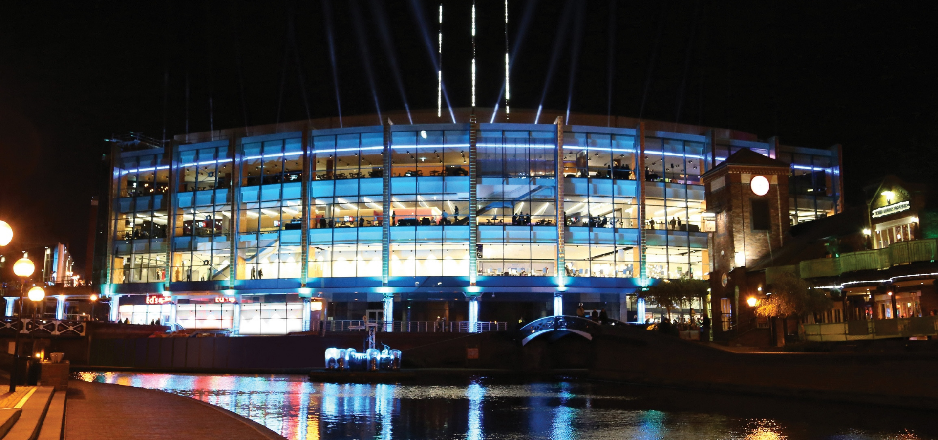 Exterior of Arena Birmingham overlooking the canal at night.