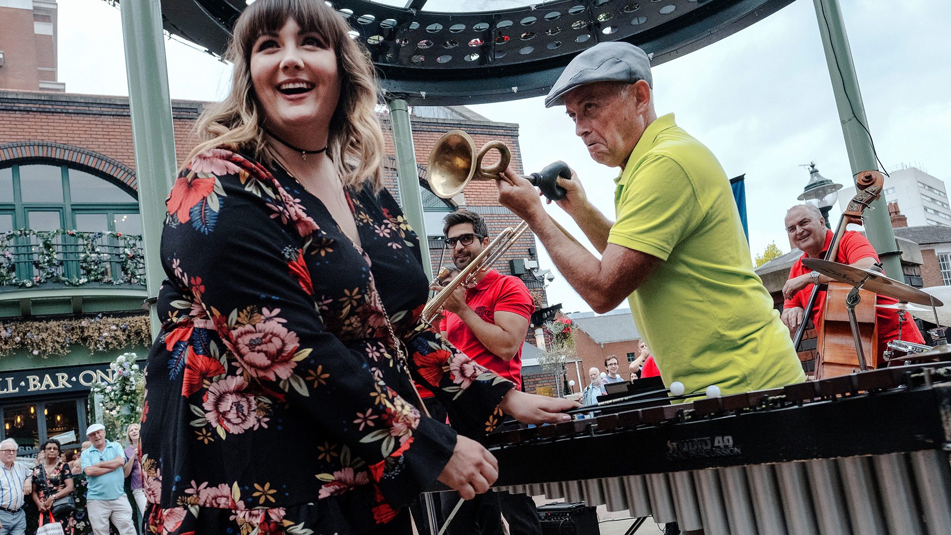 Man tooting his horn at a woman in Brindleyplace, Birmingham.