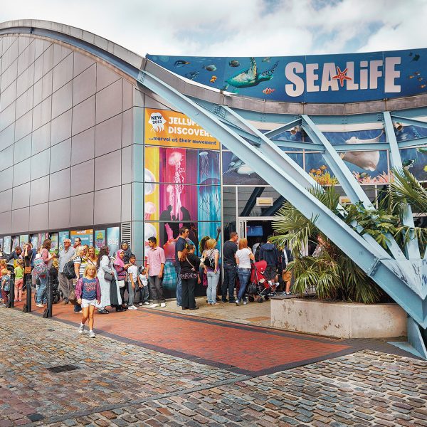 Queue of people waiting to enter the national SEA LIFE centre in Birmingham.