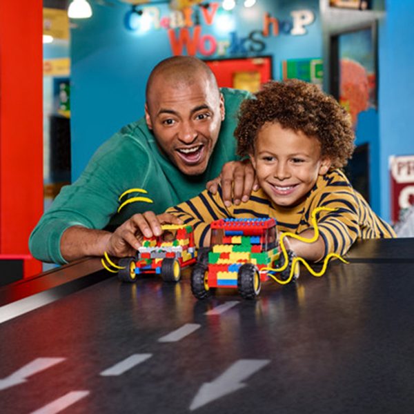 Parent and child playing with lego at LEGOLAND Discovery Centre in Birmingham.