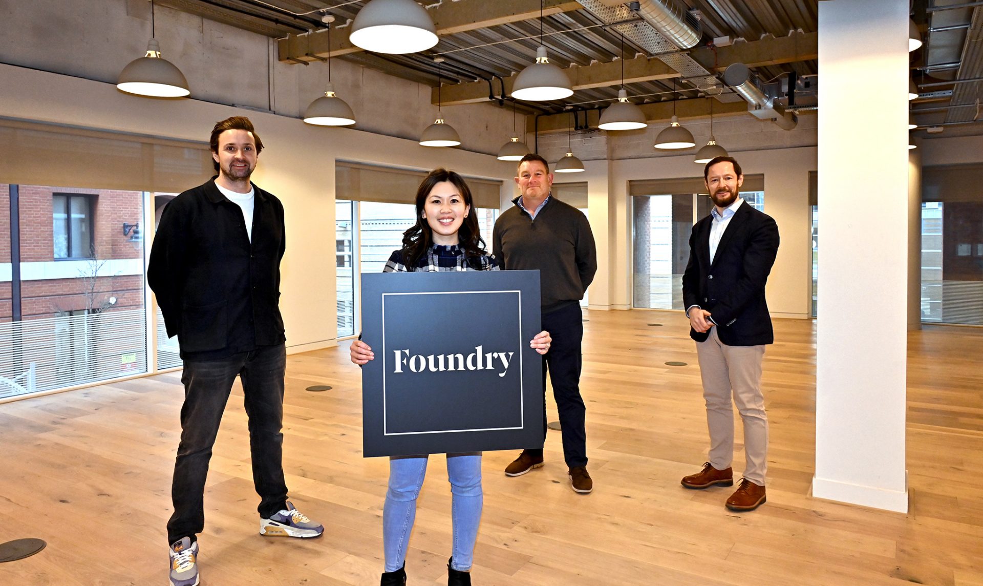 A group photo of (L-R) Phil Nevin (x+why), Angela St Clair Ford (JRA), Matt Long (Brindleyplace) and Charles Wolverson (Intex Projects) announcing the name Foundry for Six Brindleyplace.