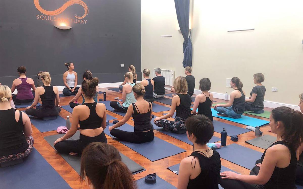 People doing guided yoga by Laura Clayton at Soul Sanctuary.
