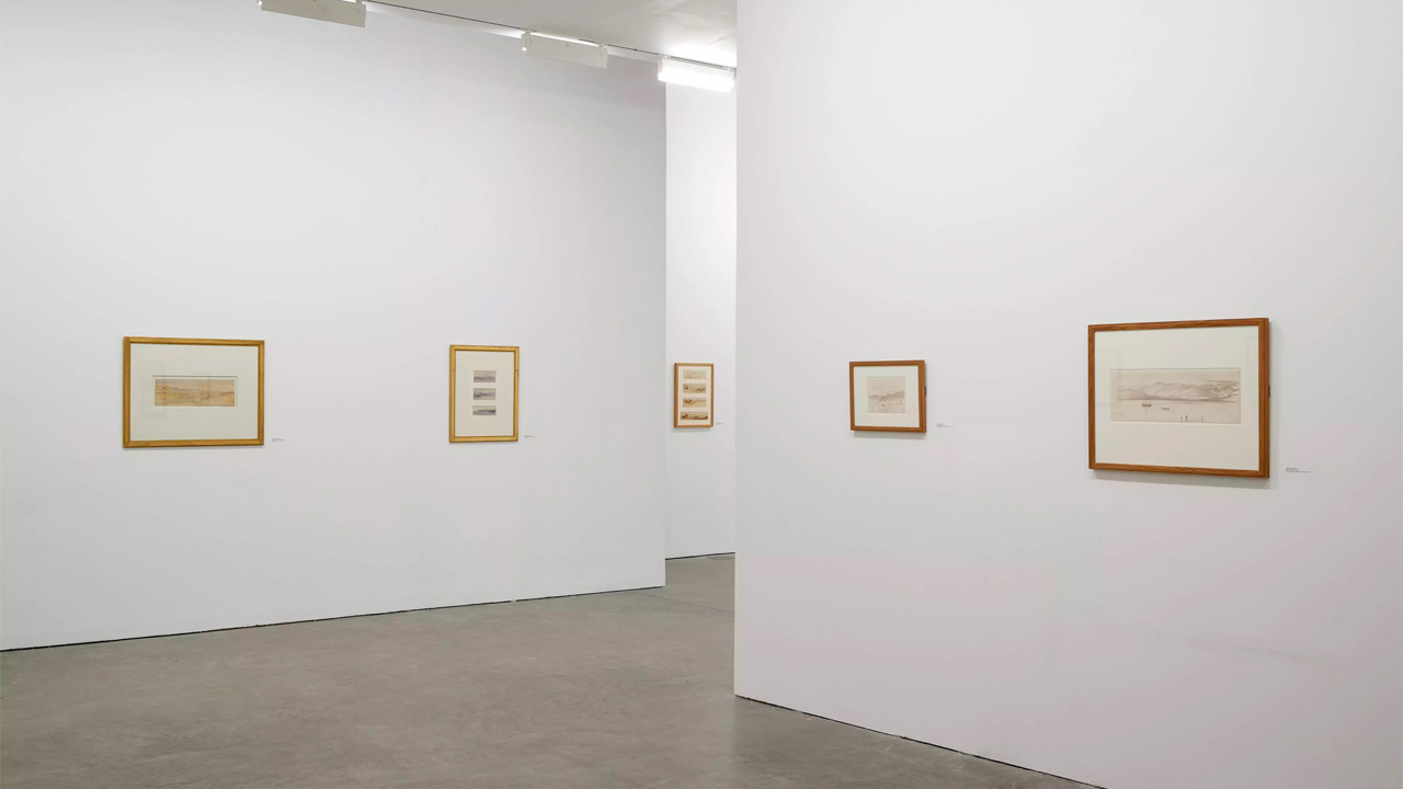 Art gallery walls, with various Edward Lear artworks framed on.